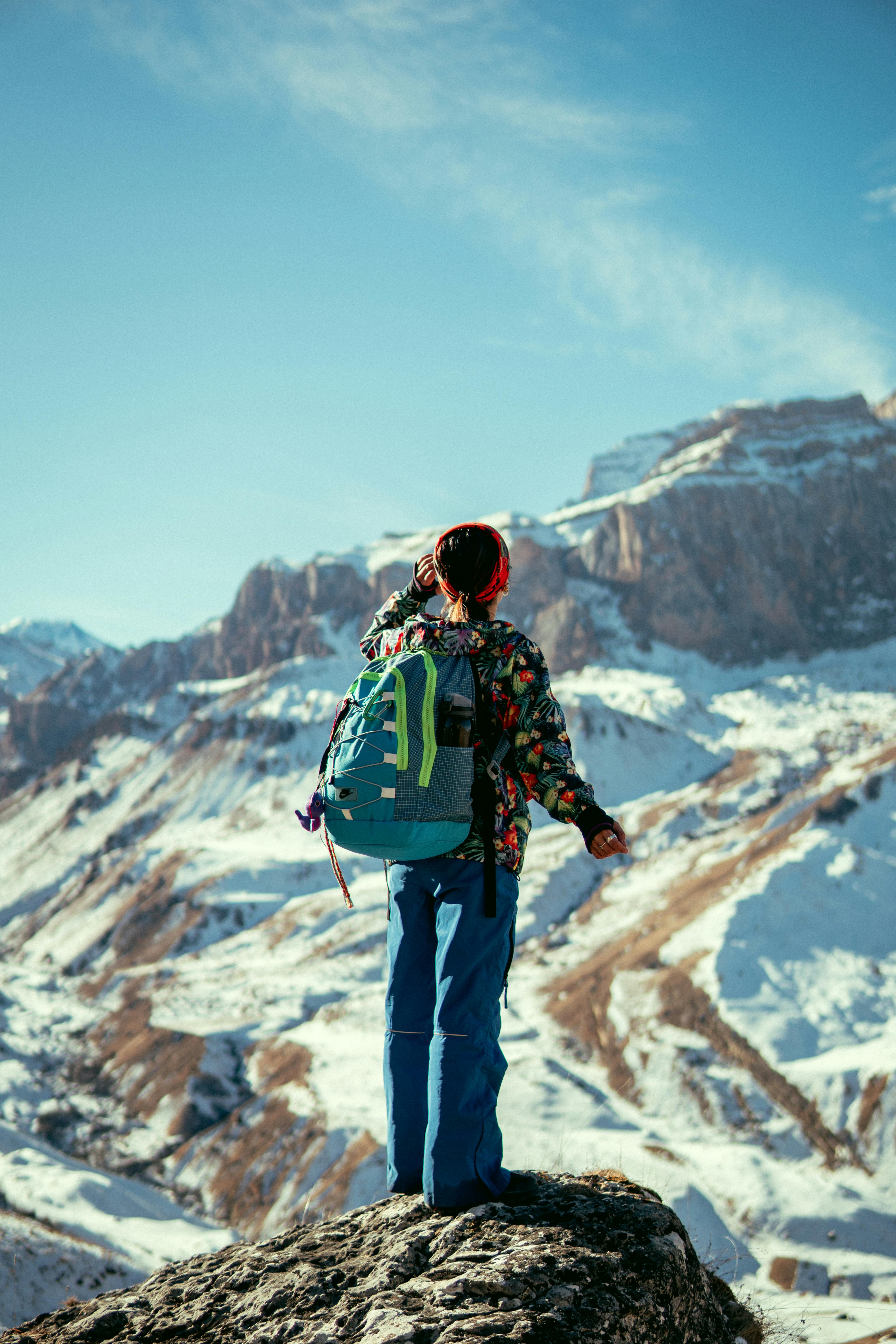 Hiker near snow covered mountain